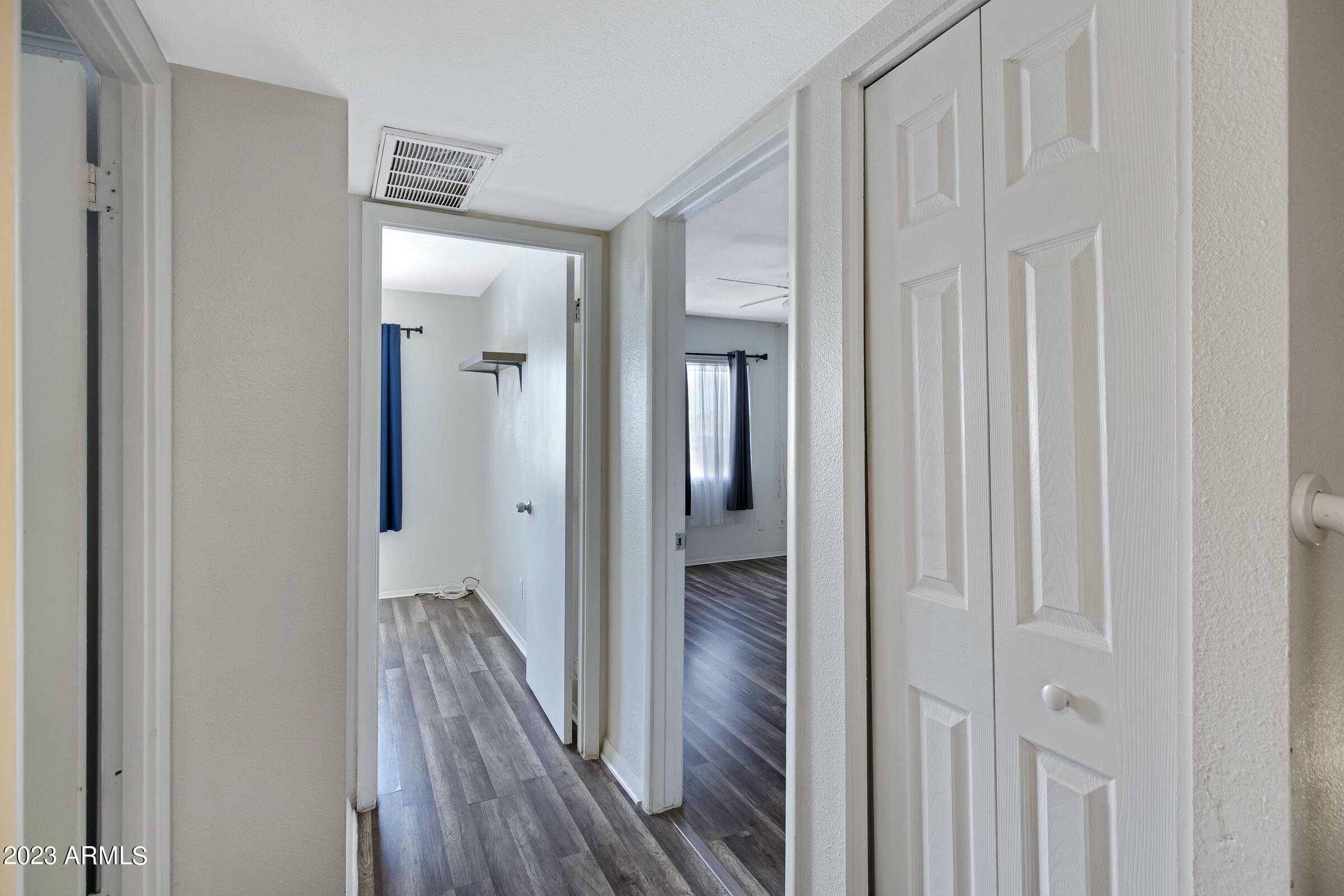 948 South Alma School Road, Unit 147 Mesa, AZ 85210 - Photo 14 of 22 a view of a hallway with wooden floor