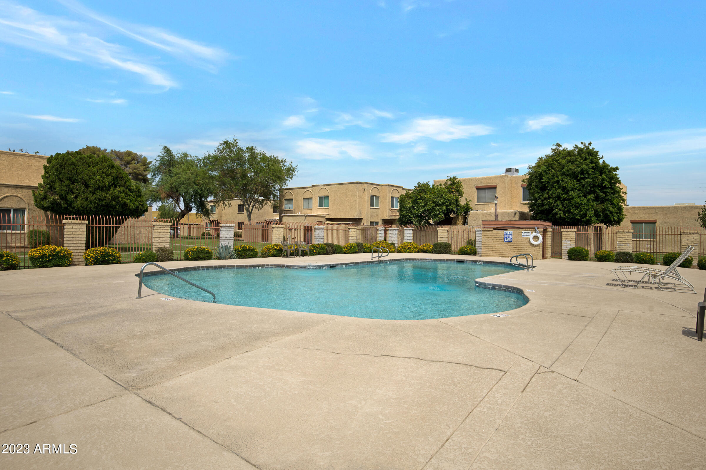 948 South Alma School Road, Unit 147 Mesa, AZ 85210 - Photo 19 of 22 a view of a swimming pool and a yard