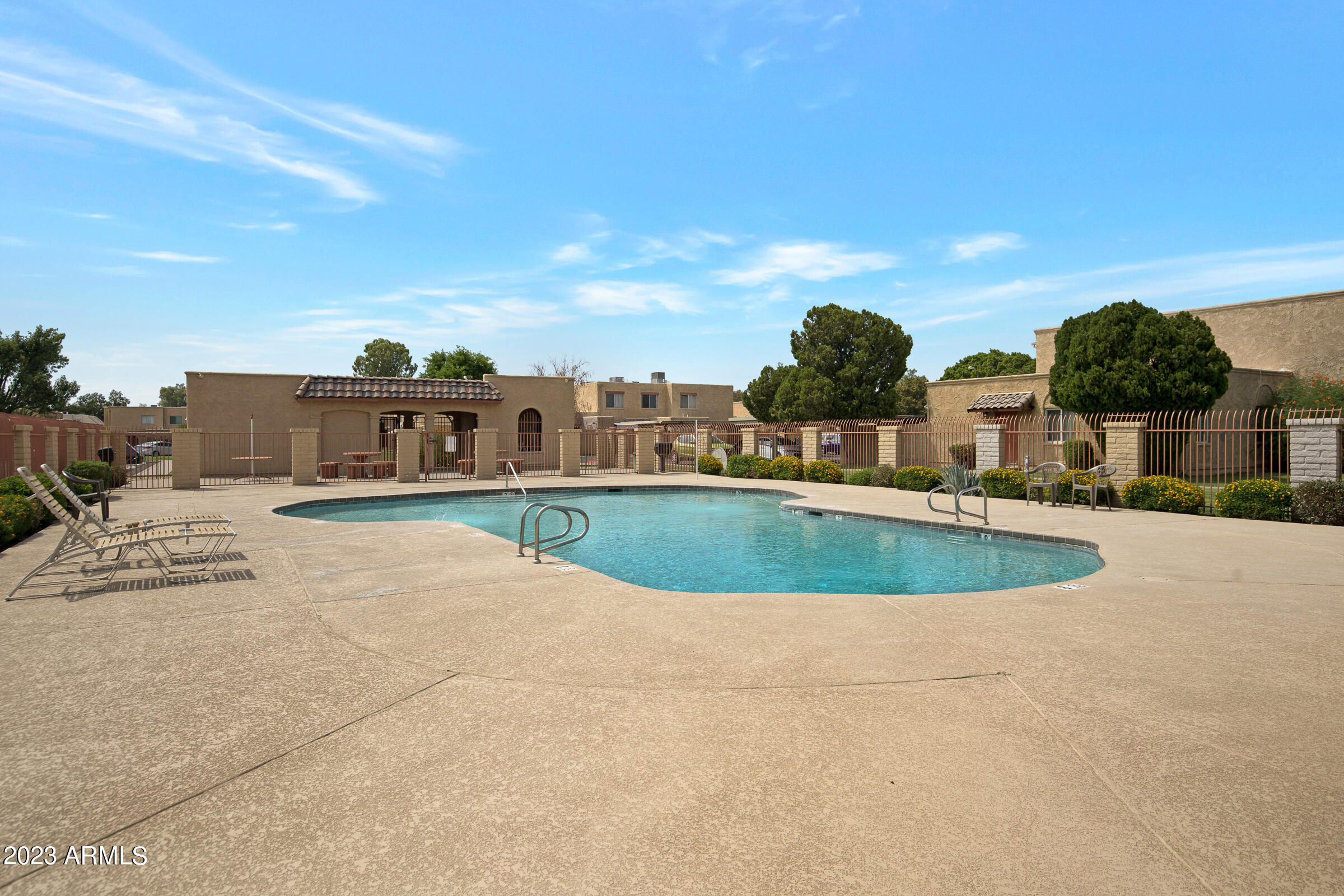 948 South Alma School Road, Unit 147 Mesa, AZ 85210 - Photo 20 of 22 a view of a house with a swimming pool