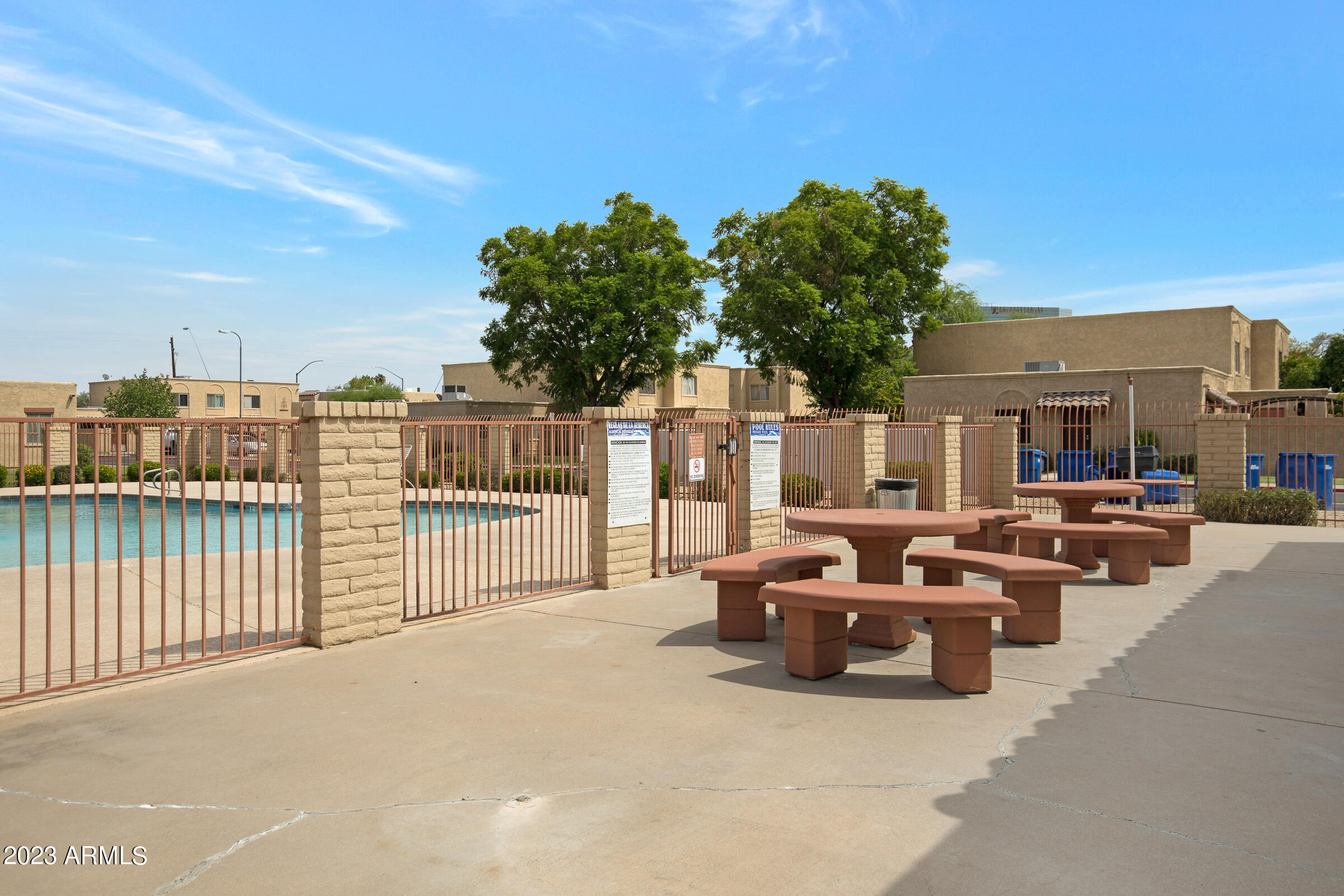 948 South Alma School Road, Unit 147 Mesa, AZ 85210 - Photo 22 of 22 a view of a patio with couches and potted plants
