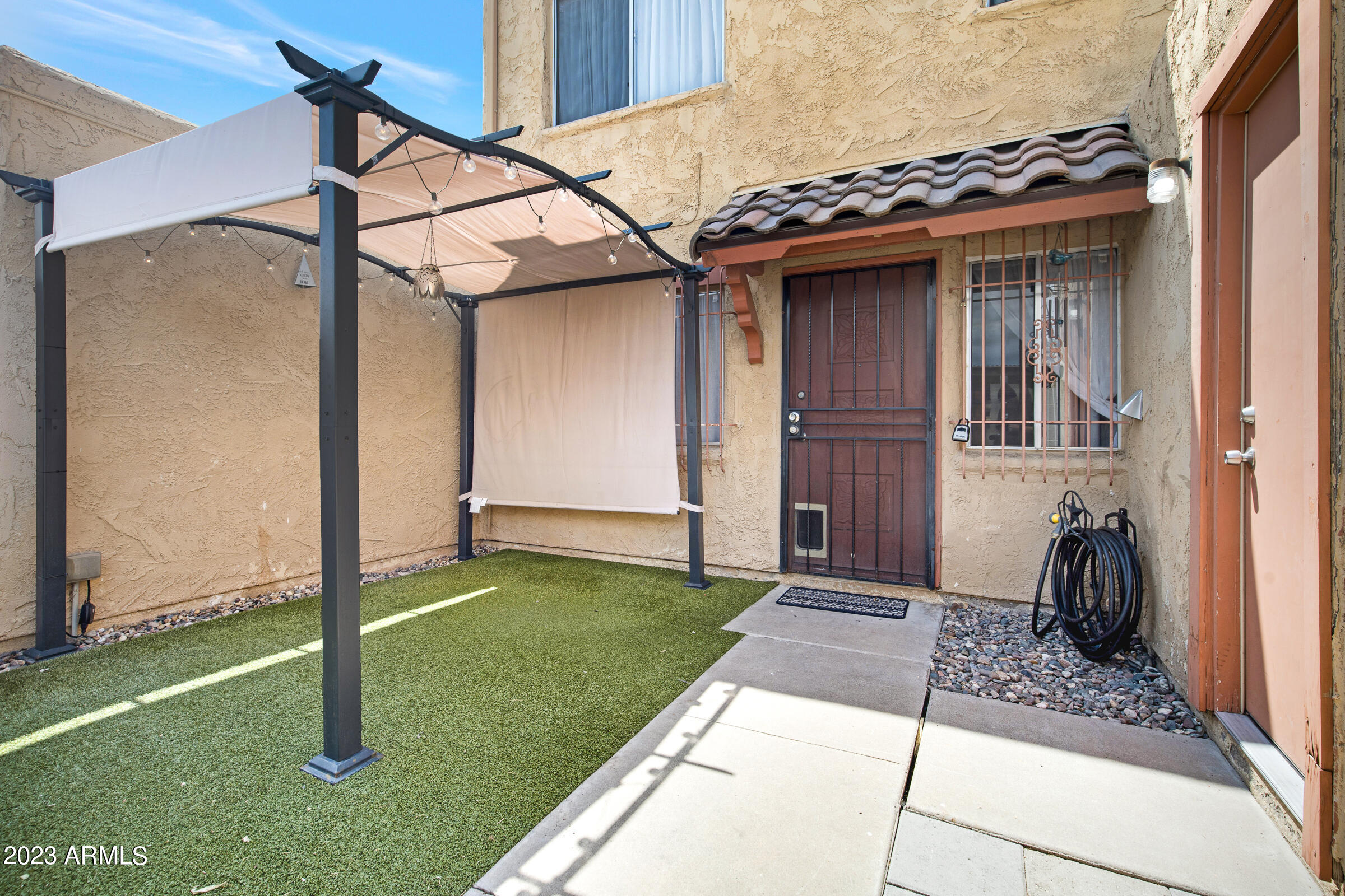 948 South Alma School Road, Unit 147 Mesa, AZ 85210 - Photo 4 of 22 a view of a house with a porch