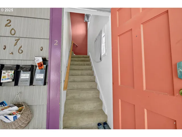 a view of entryway with a front door