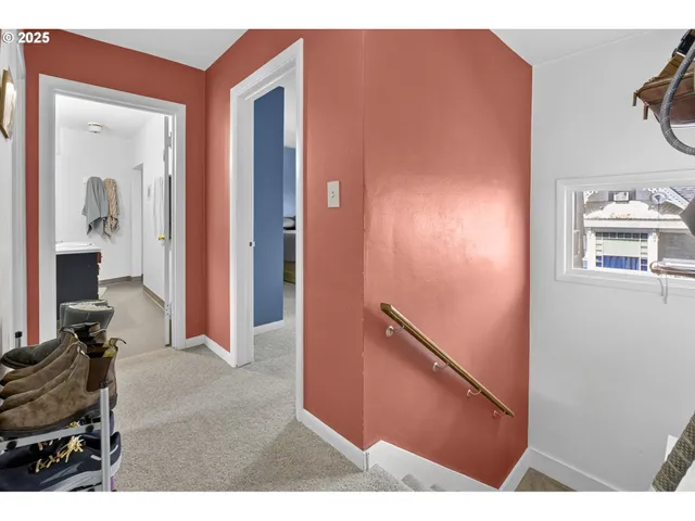a view of a livingroom with furniture and a bedroom