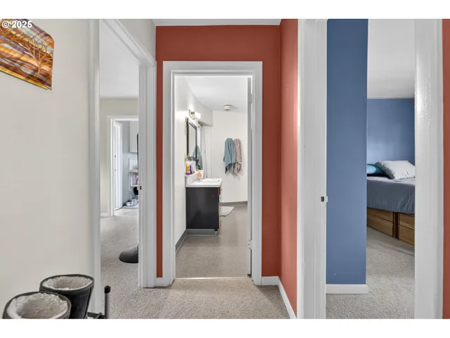 a view of a bathroom from a hallway