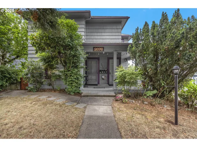 a view of entrance of house with green space