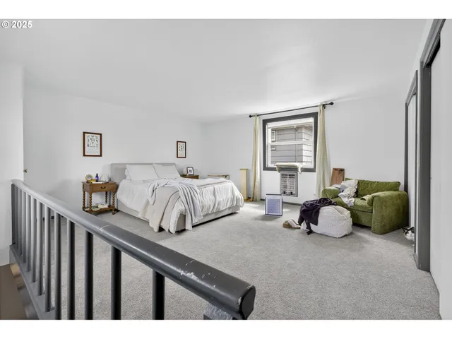 a bedroom with bed and a window