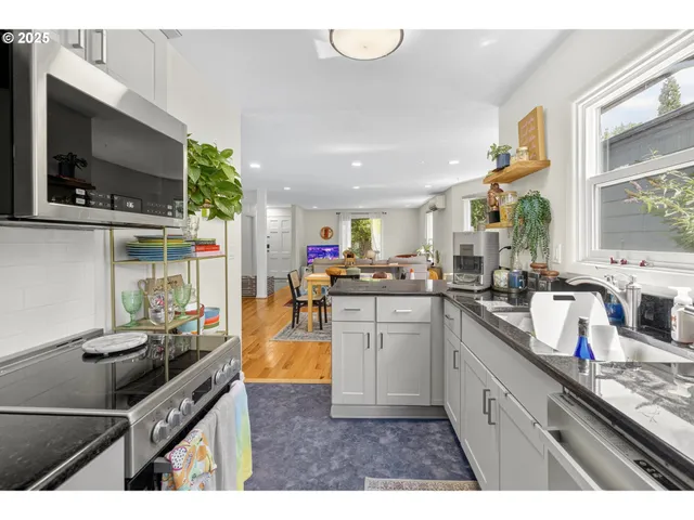 a kitchen with sink cabinets and window