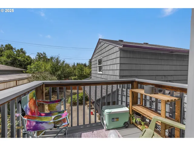 a view of a balcony with chairs