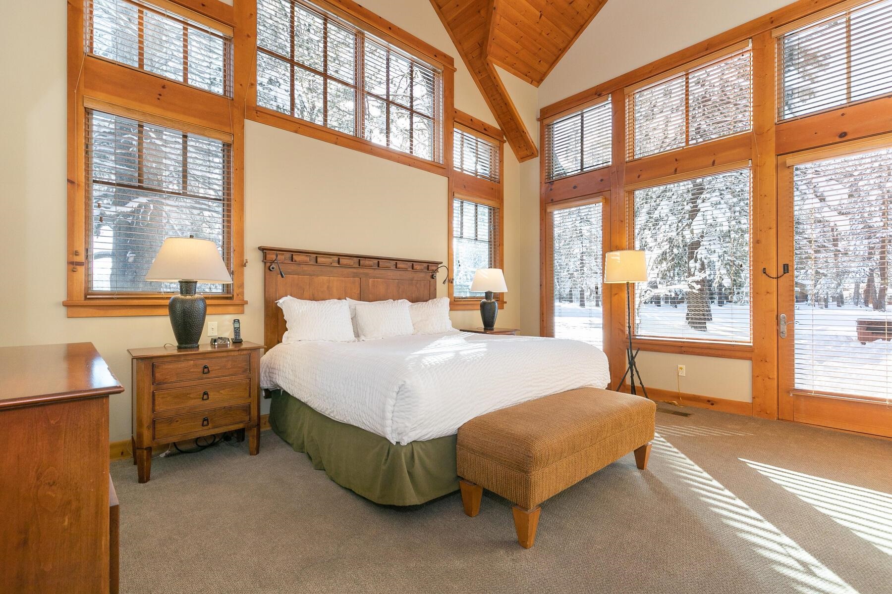12229 Lookout Loop, Unit F513 Truckee, CA 96161 - Photo 13 of 28 a bed sitting in a bedroom next to a large window