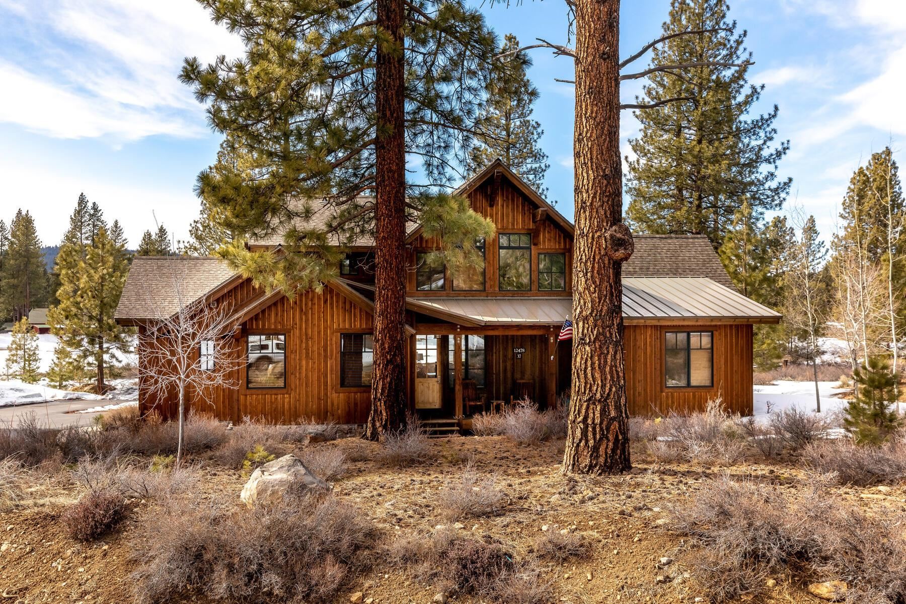 12229 Lookout Loop, Unit F513 Truckee, CA 96161 - Photo 3 of 28 a view of a large house with a tree in front of it