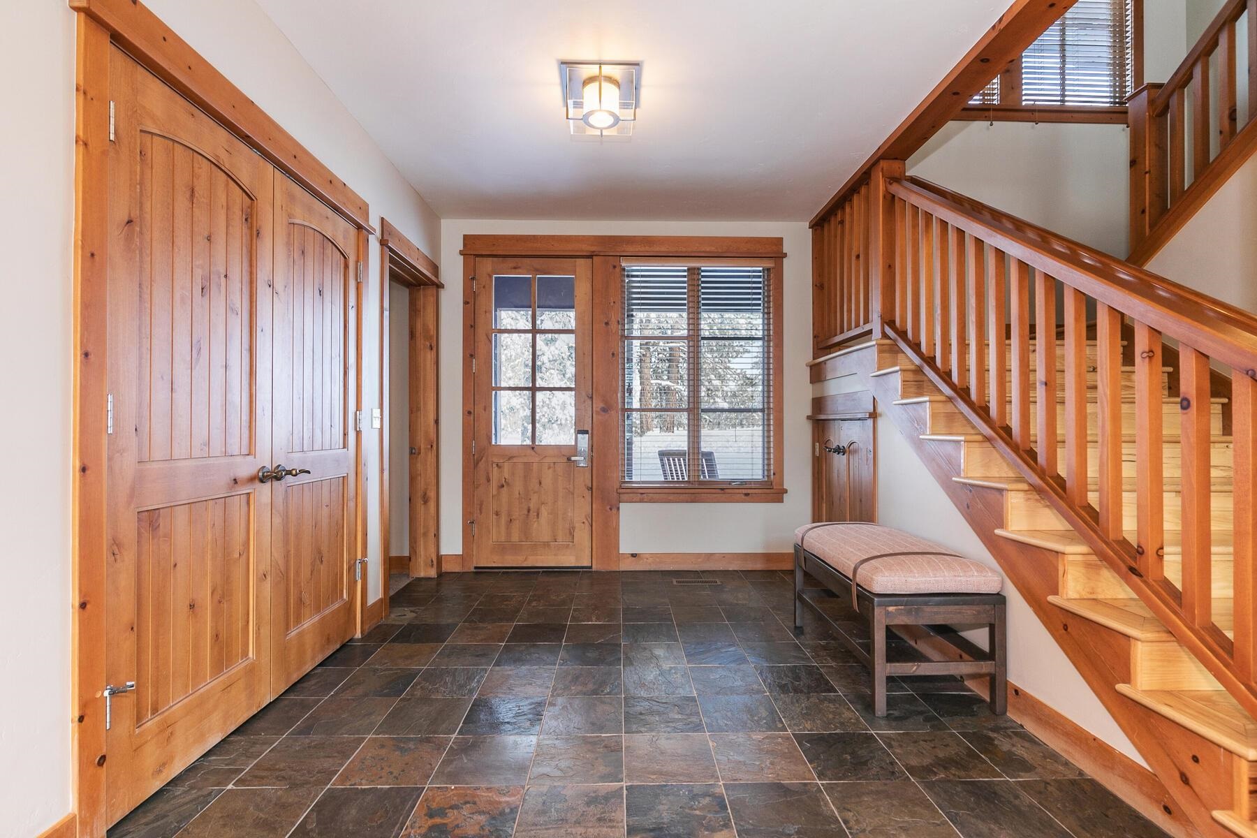 12229 Lookout Loop, Unit F513 Truckee, CA 96161 - Photo 8 of 28 a view of an entryway with wooden floor and stairs