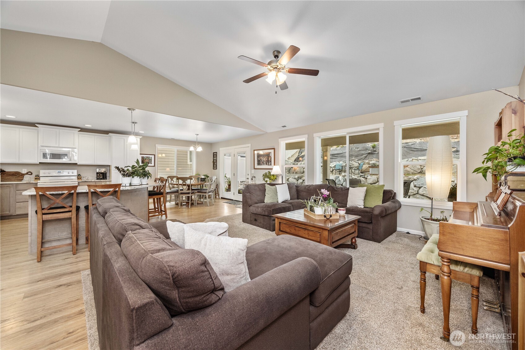 479 Spring View Place Chelan, WA 98816 - Photo 13 of 37 a living room with furniture kitchen view and a large window