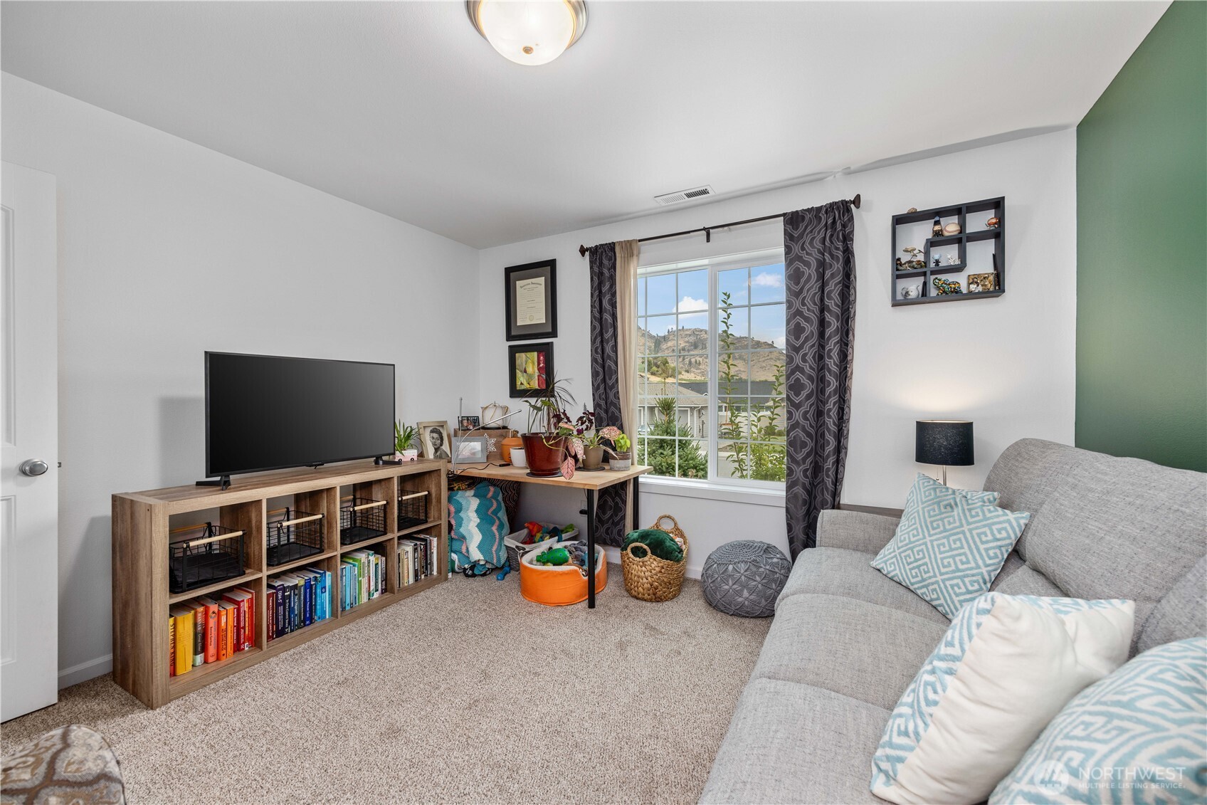 479 Spring View Place Chelan, WA 98816 - Photo 17 of 37 a living room with furniture and a flat screen tv