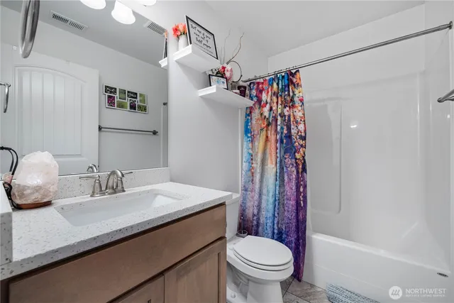 a en suite bathroom with a sink and a mirror