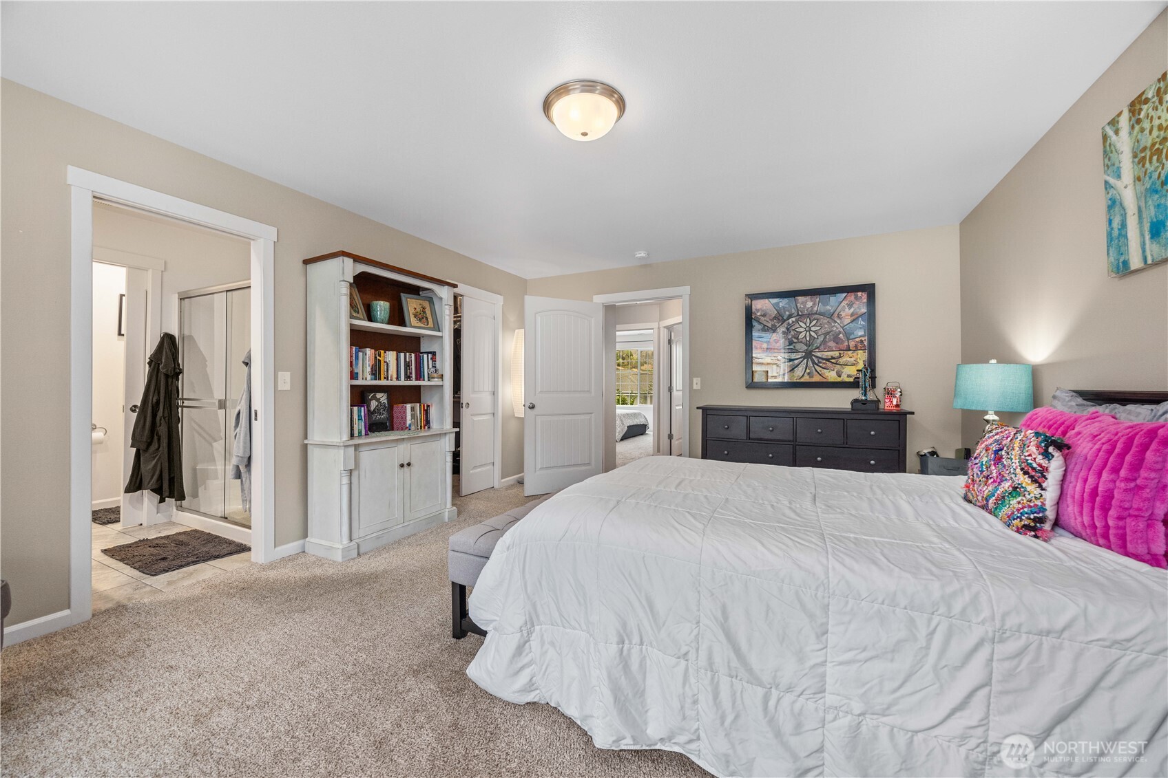 479 Spring View Place Chelan, WA 98816 - Photo 23 of 37 a spacious bedroom with a bed and a cabinets