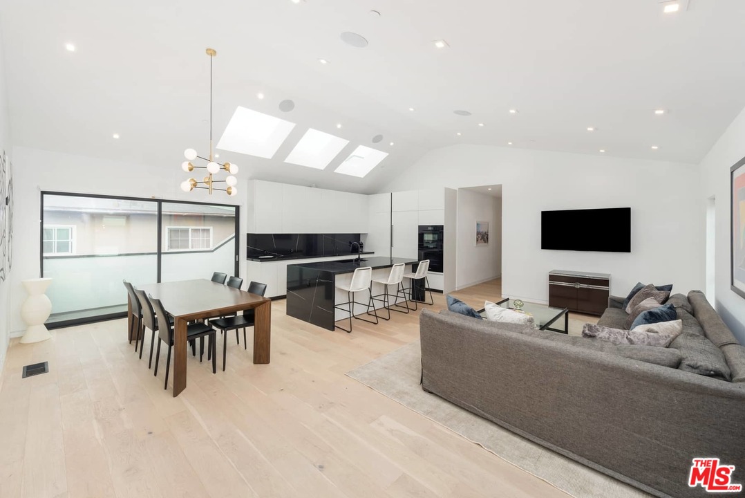 629 Sunset Avenue Venice, CA 90291 - Photo 7 of 31 a living room with furniture a flat screen tv and kitchen view