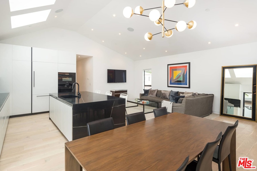 629 Sunset Avenue Venice, CA 90291 - Photo 8 of 31 a living room with furniture a flat screen tv and kitchen view