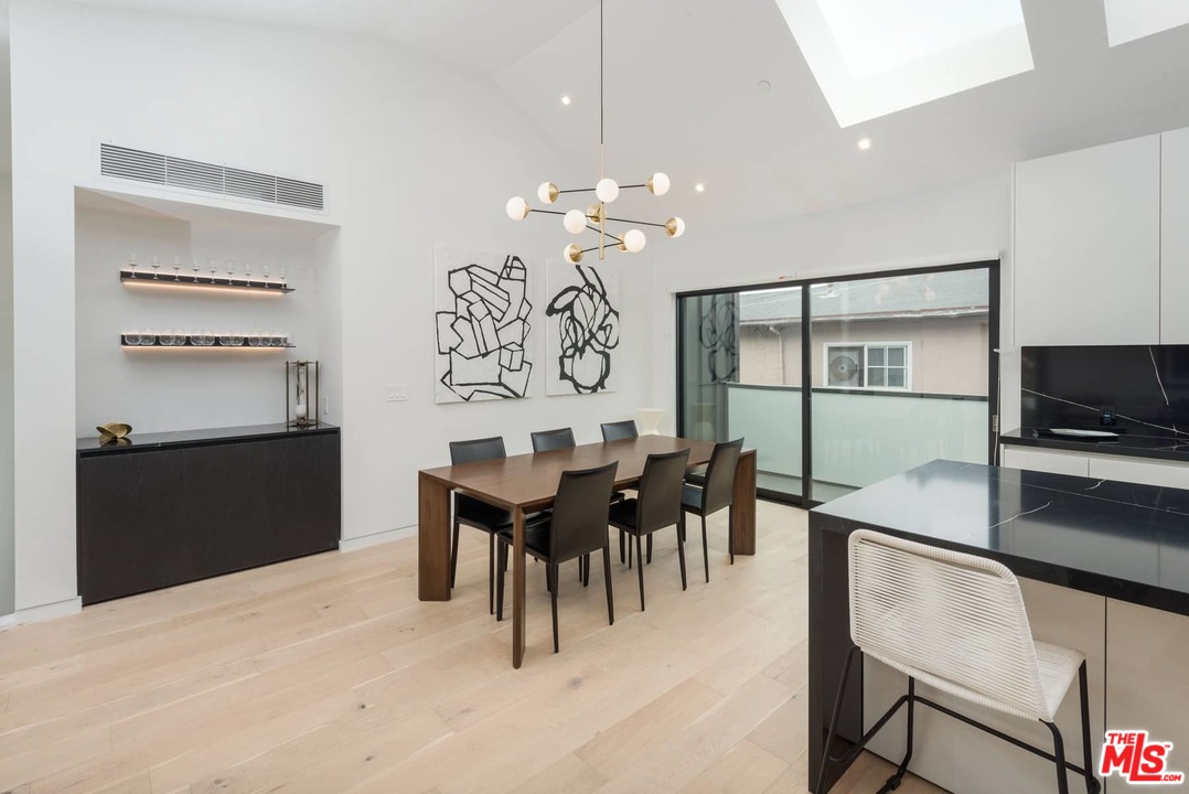 629 Sunset Avenue Venice, CA 90291 - Photo 10 of 31 a view of a dining room with furniture and a chandelier