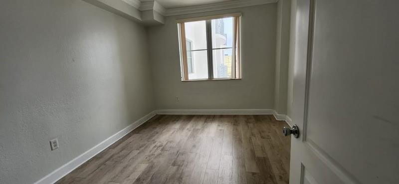 1830 Radius Drive, Unit 1003 Hollywood, FL 33020 - Photo 8 of 12 a view of a room with wooden floor and a window