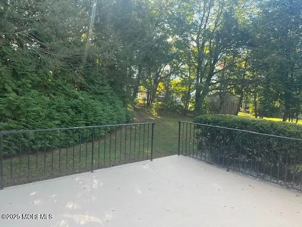 a balcony with a lake view