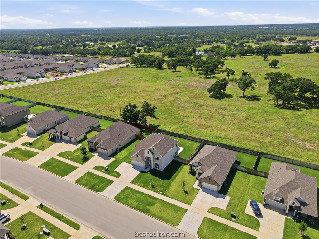 1922 Viva Road Bryan, TX 77807 - Photo 39 of 45 Stunning aerial perspective showcasing rare privacy with no rear neighbors and ranch views behind the home.