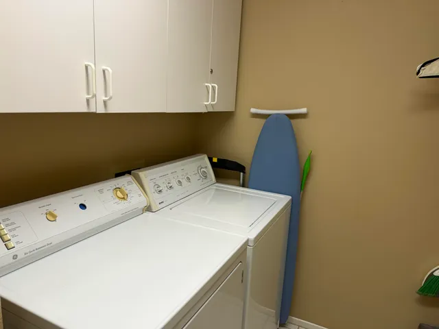 a utility room with dryer and washer