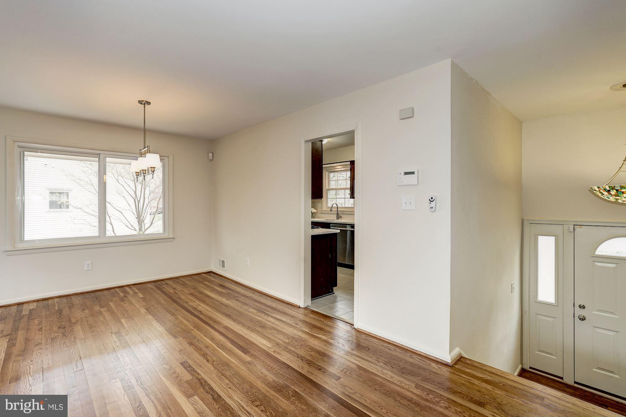 8403 Wagon Wheel Road Alexandria, VA 22309 - Photo 10 of 47 Dining area off kitchen w/ rich hardwood floors