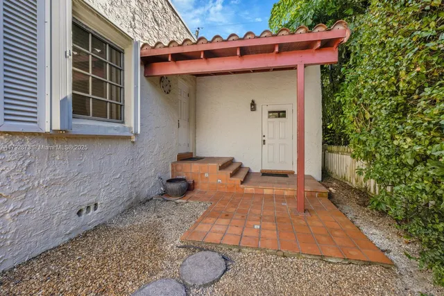 a backyard of a house with seating space