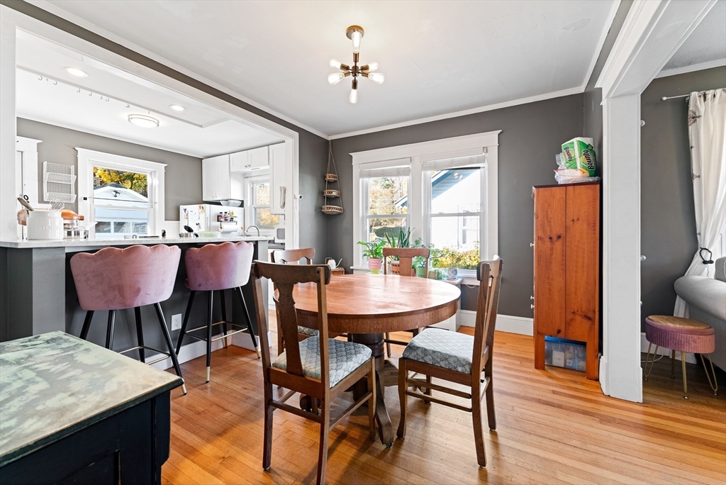 39 Catherine Street Pittsfield, MA 01201 - Photo 11 of 36 a dining room with furniture a window and wooden floor