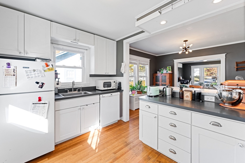 39 Catherine Street Pittsfield, MA 01201 - Photo 15 of 36 a kitchen with granite countertop white cabinets and white appliances