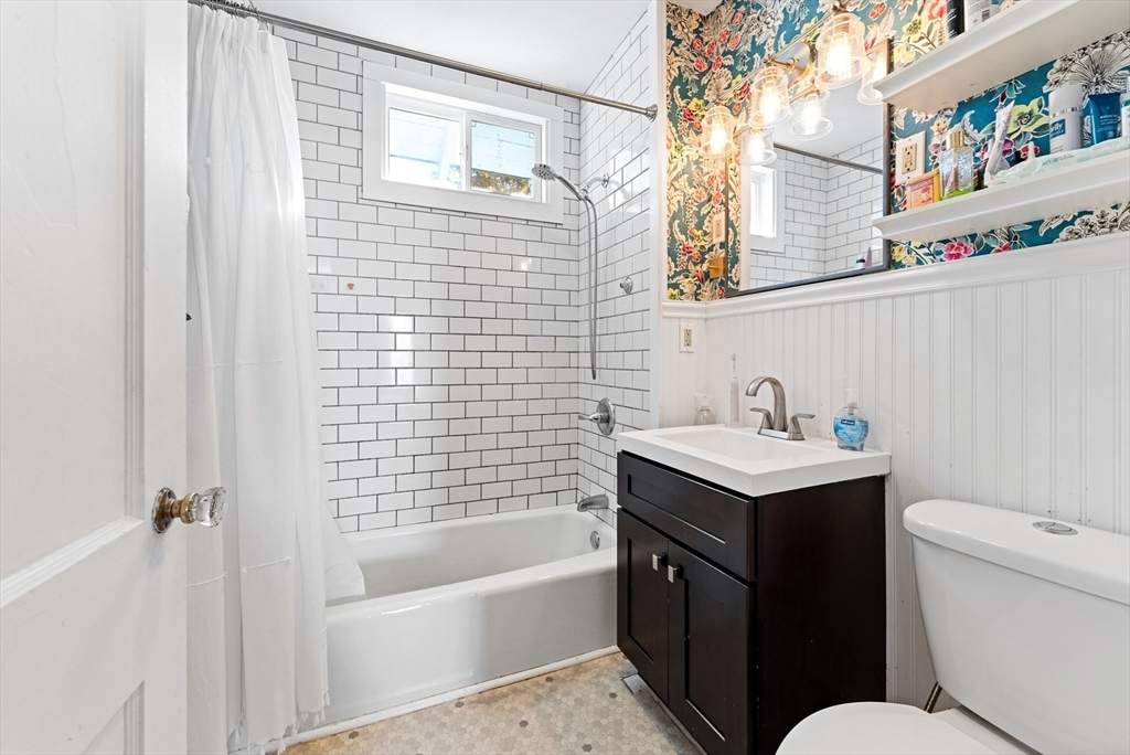 39 Catherine Street Pittsfield, MA 01201 - Photo 22 of 36 a bathroom with a sink toilet and vanity