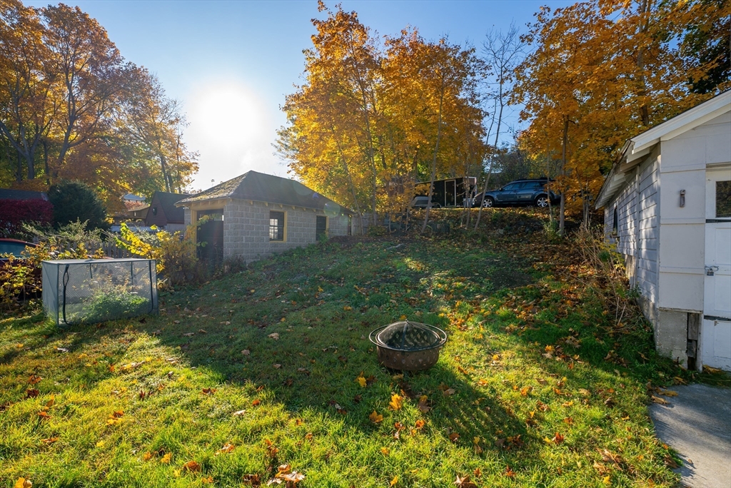 39 Catherine Street Pittsfield, MA 01201 - Photo 31 of 36 a view of a backyard with table and chairs and potted plants