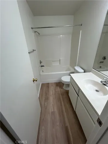 a room with a sink and mirror