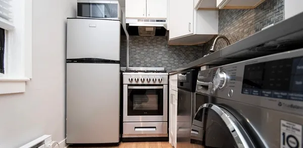 a view of an entryway with cabinet