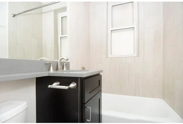 a bathroom with a sink and a bathtub