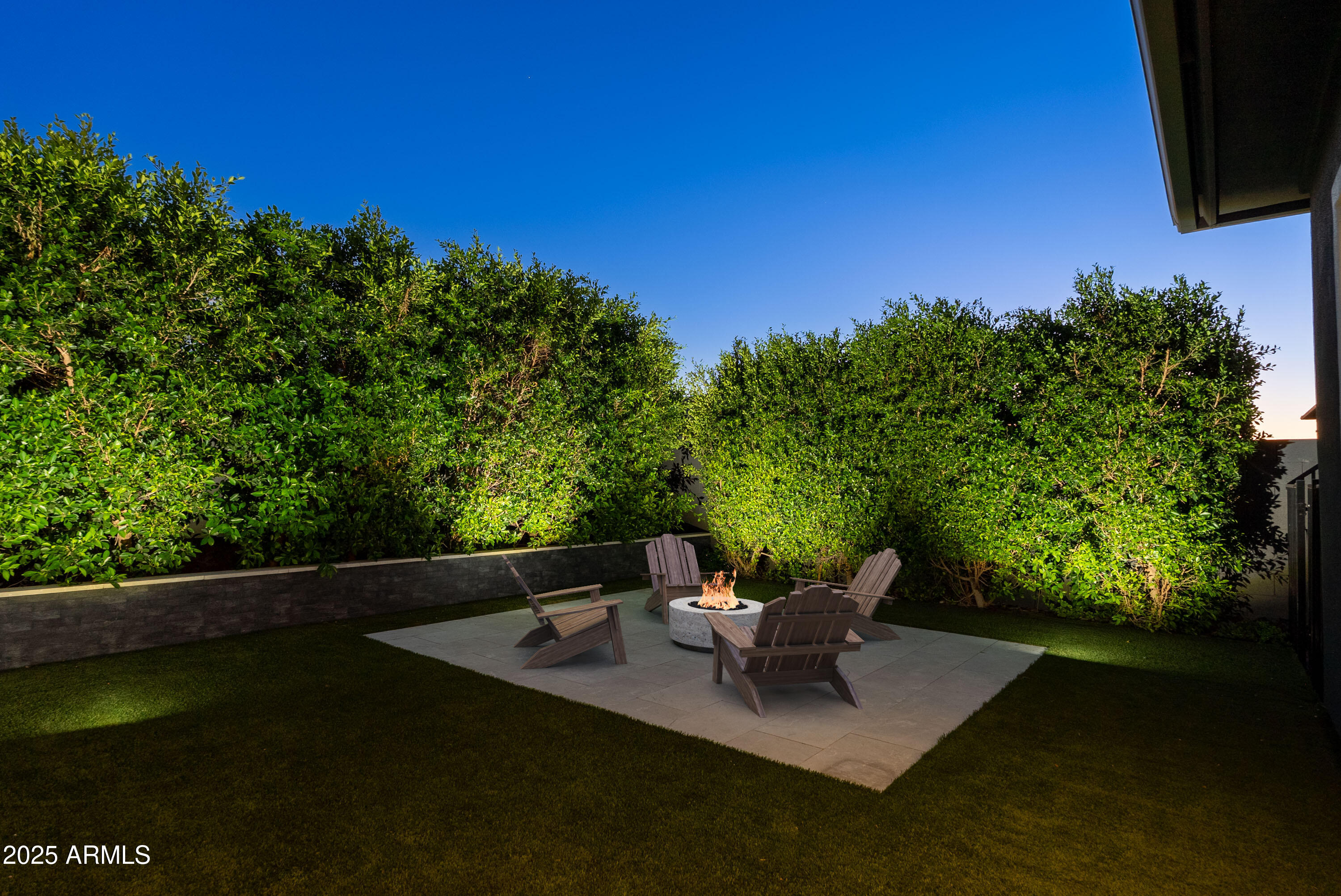 3145 East Boot Track Trail Gilbert, AZ 85296 - Photo 10 of 17 a view of a patio with lawn chairs under an umbrella