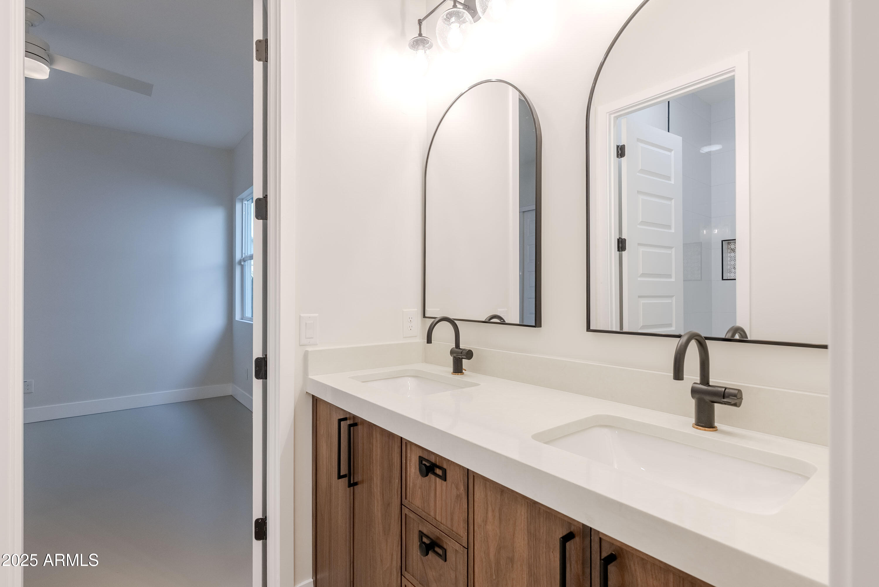 3145 East Boot Track Trail Gilbert, AZ 85296 - Photo 11 of 17 a bathroom with a double vanity sink and a mirror