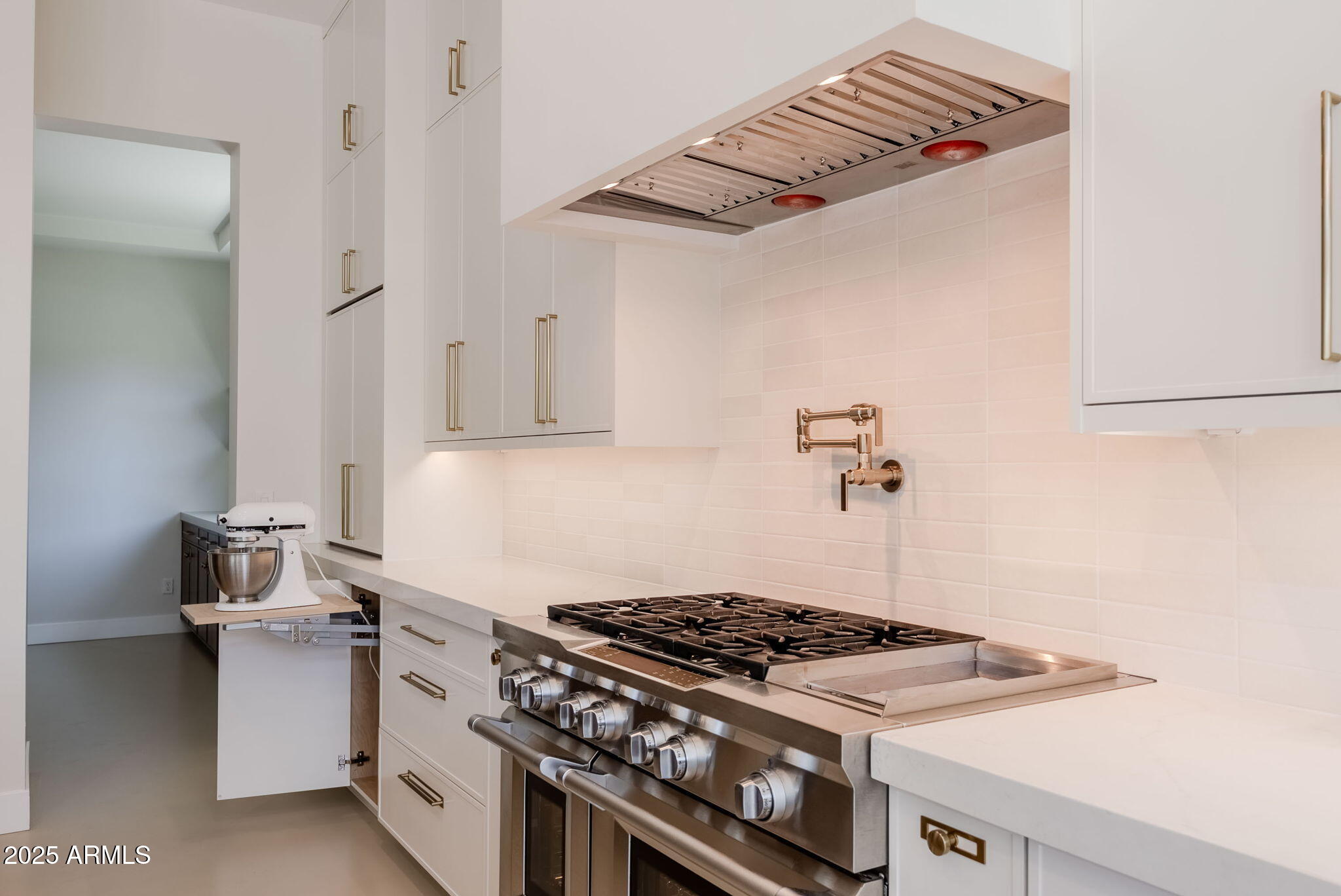 3145 East Boot Track Trail Gilbert, AZ 85296 - Photo 5 of 17 a stove top oven sitting inside of a kitchen