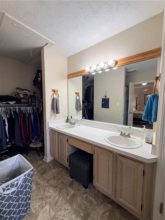 3680 Hamilton Dam Road Dacula, GA 30019 - Photo 21 of 33 a bathroom with a double vanity sink and a mirror