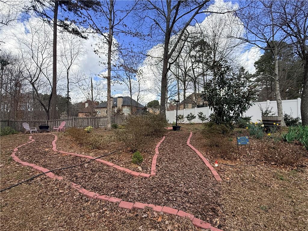 3680 Hamilton Dam Road Dacula, GA 30019 - Photo 28 of 33 a backyard of apartments with large trees