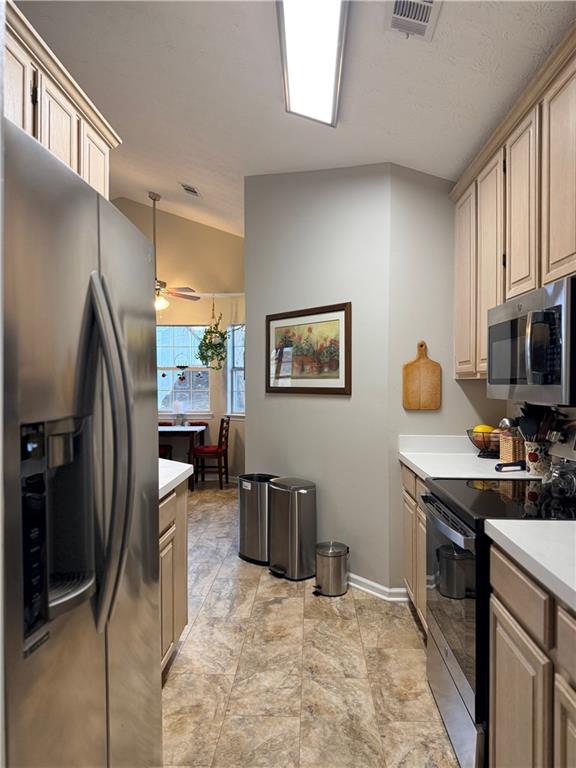 3680 Hamilton Dam Road Dacula, GA 30019 - Photo 3 of 33 a kitchen with stainless steel appliances granite countertop a refrigerator stove and sink