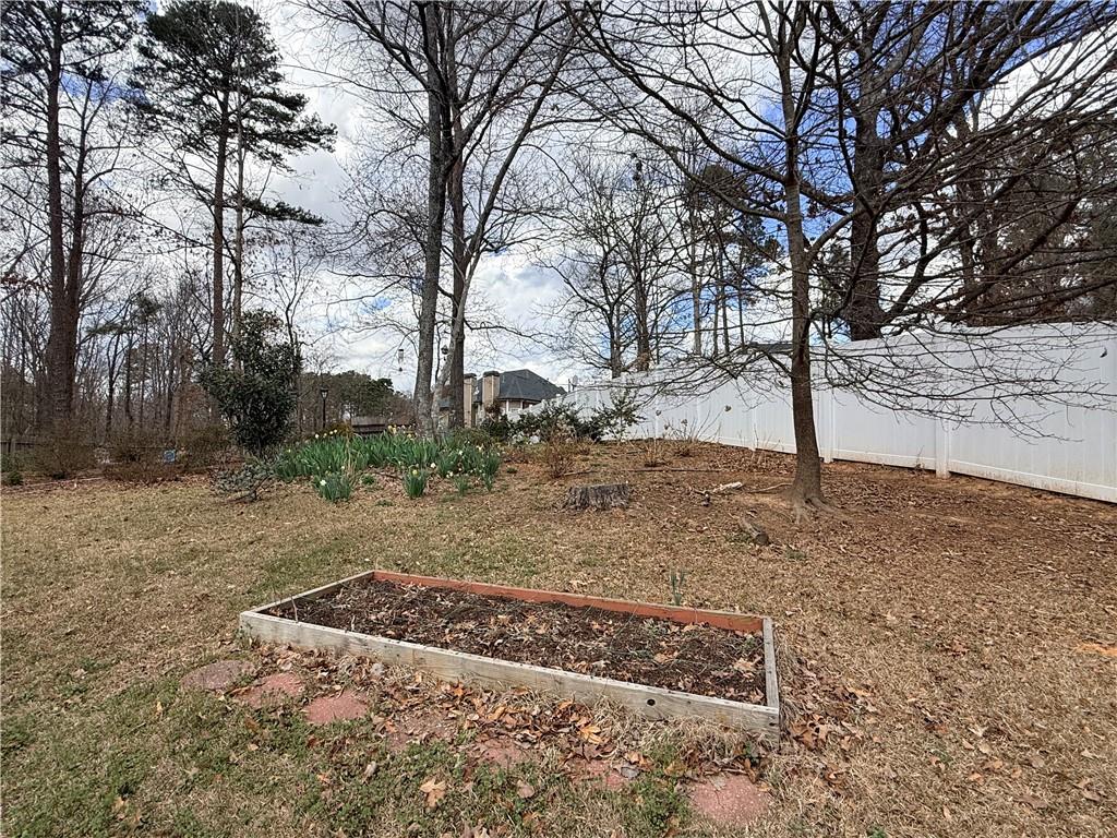 3680 Hamilton Dam Road Dacula, GA 30019 - Photo 31 of 33 a view of a yard covered with snow