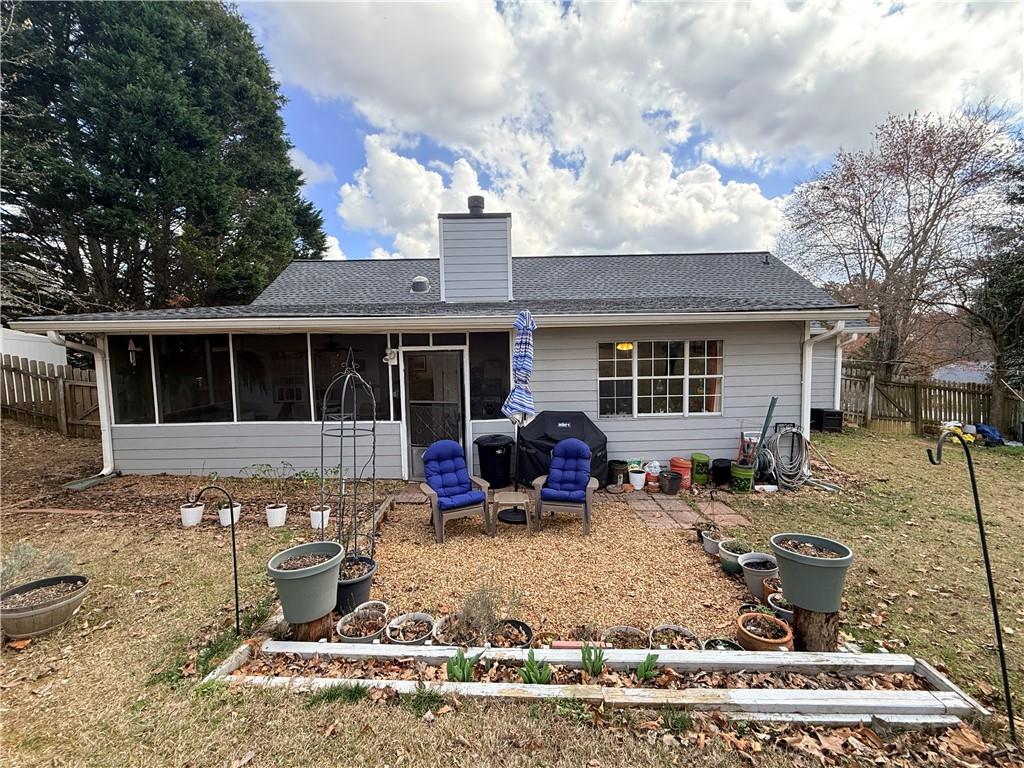 3680 Hamilton Dam Road Dacula, GA 30019 - Photo 32 of 33 a front view of a house with a yard and seating space