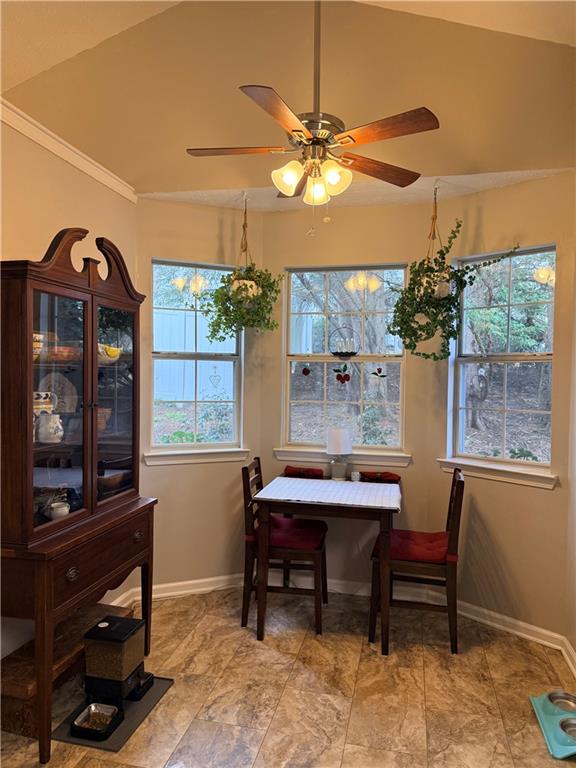 3680 Hamilton Dam Road Dacula, GA 30019 - Photo 7 of 33 a view of a dining room with furniture and chandelier