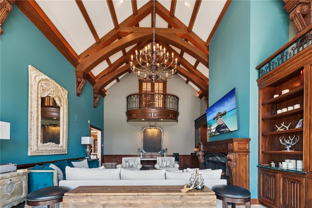 152 Justabout Road Venetia, PA 15367 - Photo 15 of 50 a living room with fireplace furniture and a chandelier