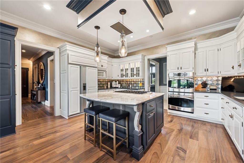 152 Justabout Road Venetia, PA 15367 - Photo 16 of 50 a kitchen with stainless steel appliances granite countertop a stove and refrigerator