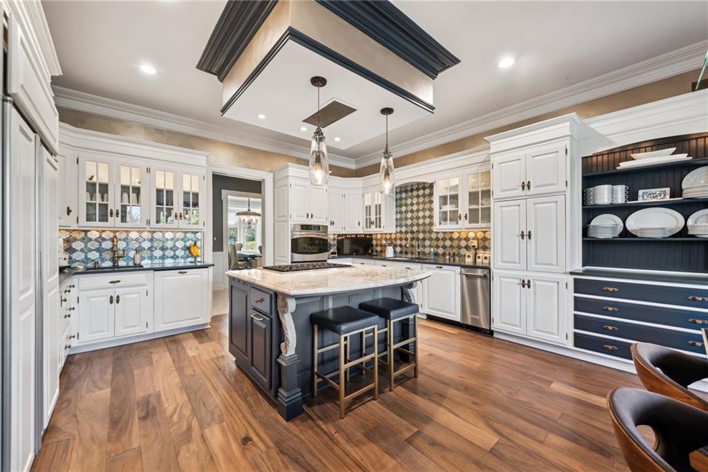 152 Justabout Road Venetia, PA 15367 - Photo 18 of 50 a kitchen with stainless steel appliances granite countertop a white stove top oven and couches