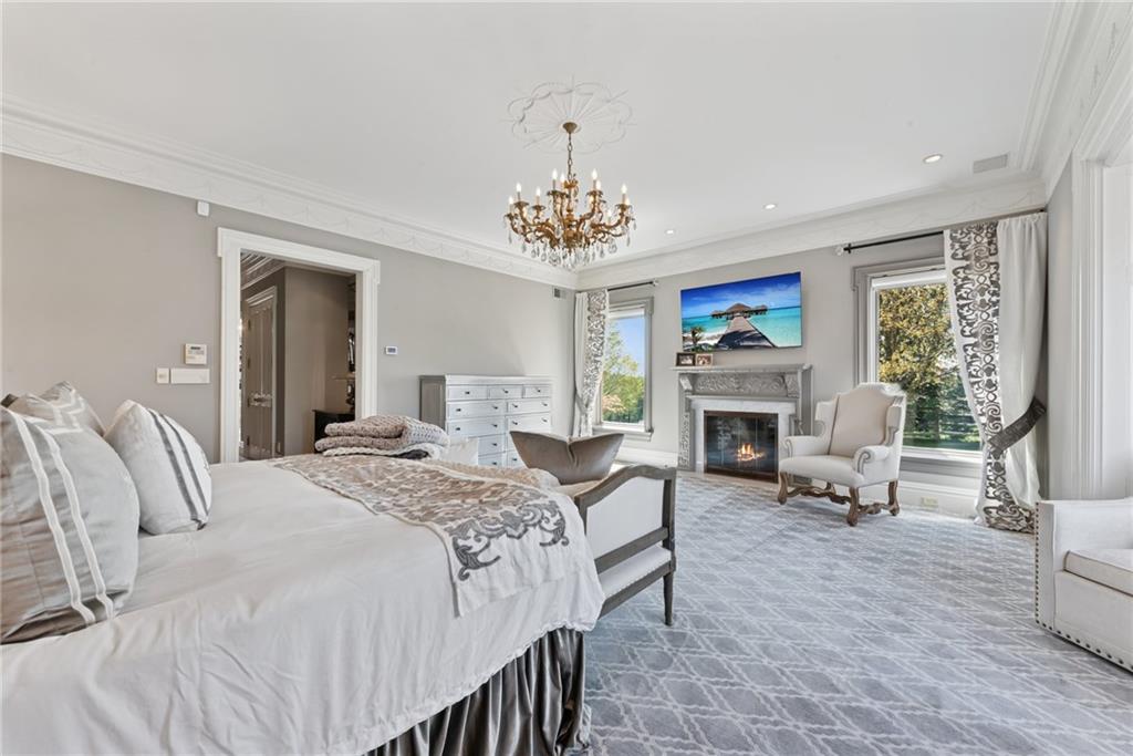 152 Justabout Road Venetia, PA 15367 - Photo 21 of 50 a bedroom with a bed and a fireplace