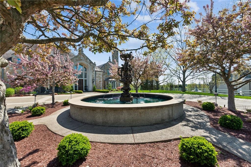 152 Justabout Road Venetia, PA 15367 - Photo 4 of 50 a view of a fountain in the yard with large trees