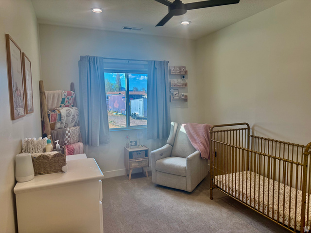 277 West 800 South Monroe, UT 84754 - Photo 27 of 46 Carpeted bedroom with a crib, a ceiling fan, and recessed lighting